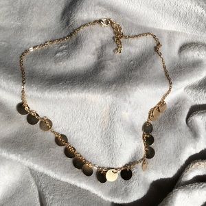 Gold disc charmed choker